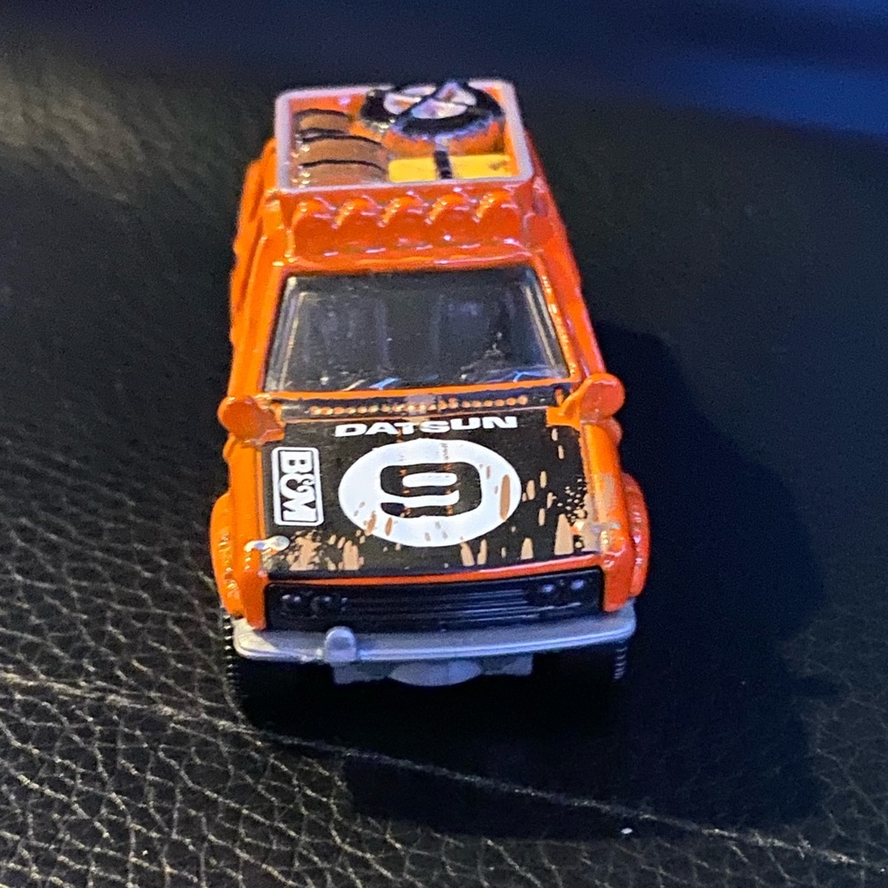 Orange Datsun matchbox car